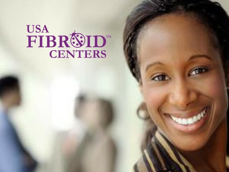 African-American woman, smiling, to the right with the USA Fibroid Centers logo floats to the left.
