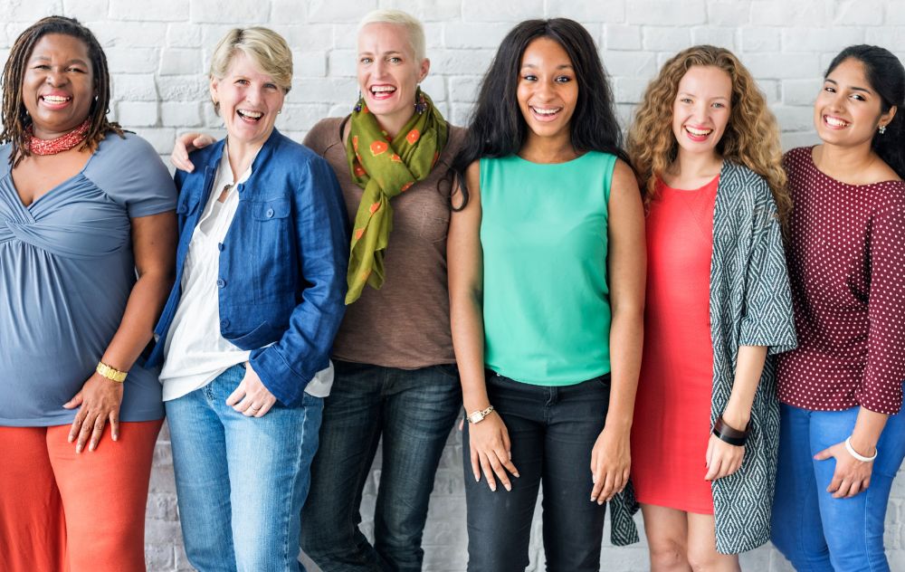 Group of women smiling about Fibroid Awareness Month