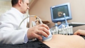 interventional radiologist diagnosing uterine fibroids with ultrasound technology