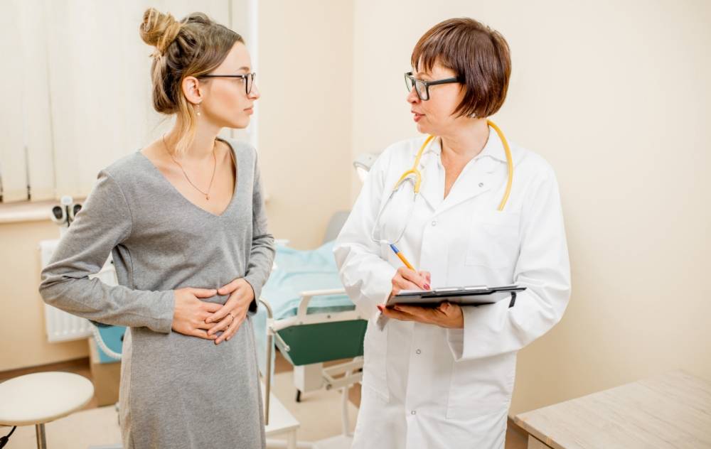 What Are The Risks And Complications Of Ufe? 12 does ufe have fewer complications-when compared to other fibroid treatments - woman talking to doctor about her fibroid treatment options