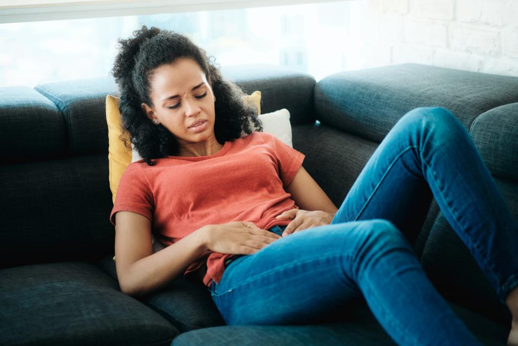 Woman struggling with fibroids. Do fibroids go away on their own?