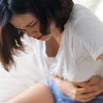 woman suffering from the symptoms of fibroids