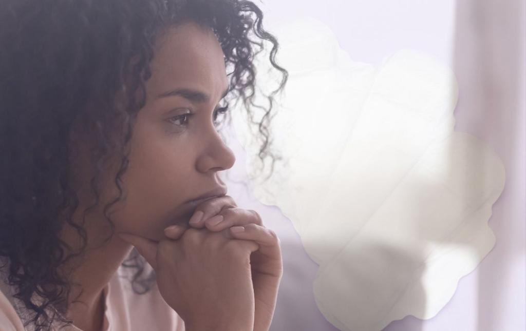 Can You Have Fibroids Without Heavy Bleeding? 3 Woman thinking about having fibroids without heavy bleeding