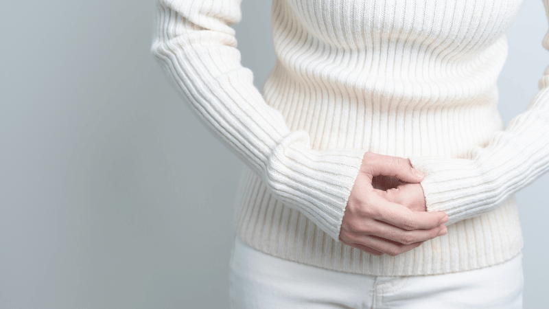 Woman with stomach pain from early Warning Signs Of Uterine Fibroids