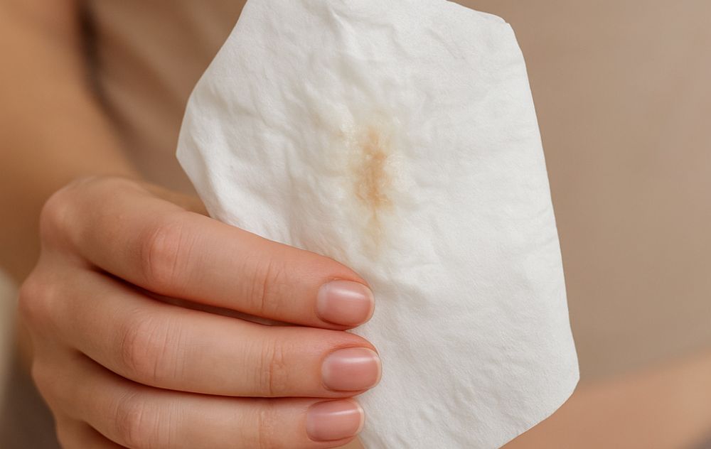 Lady researching discharge before your period