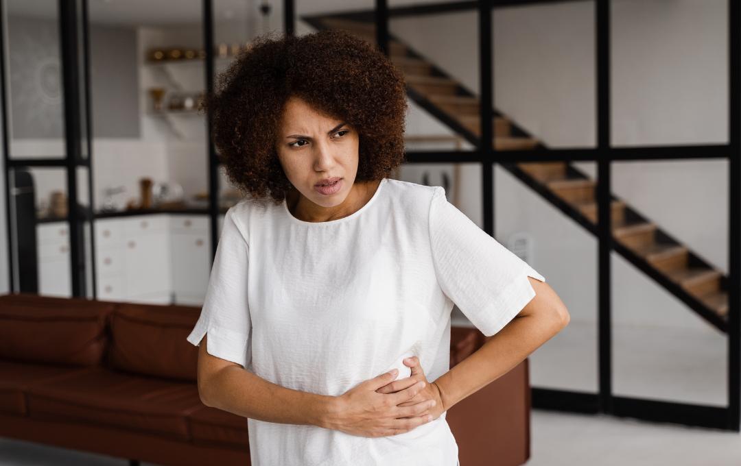 Causes Of Urinary Urgency In Females 4 Woman feeling pain and urinary urgency due to her fibroids pressing against the bladder.