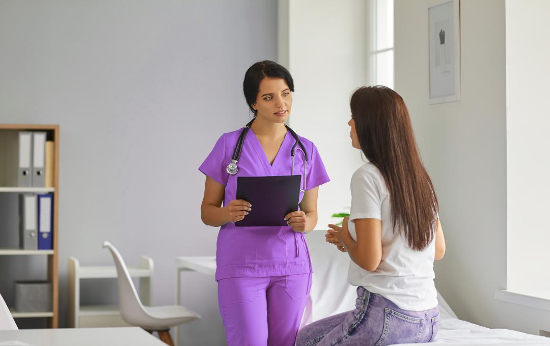 Can Fibroids Cause Miscarriages? 6 Fibroid specialist discussing treatment options with woman with fibroids