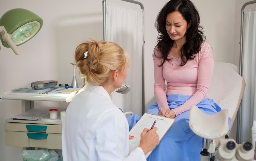 What Triggers Fibroids To Grow? 2 Woman consulting a fibroid specialist.