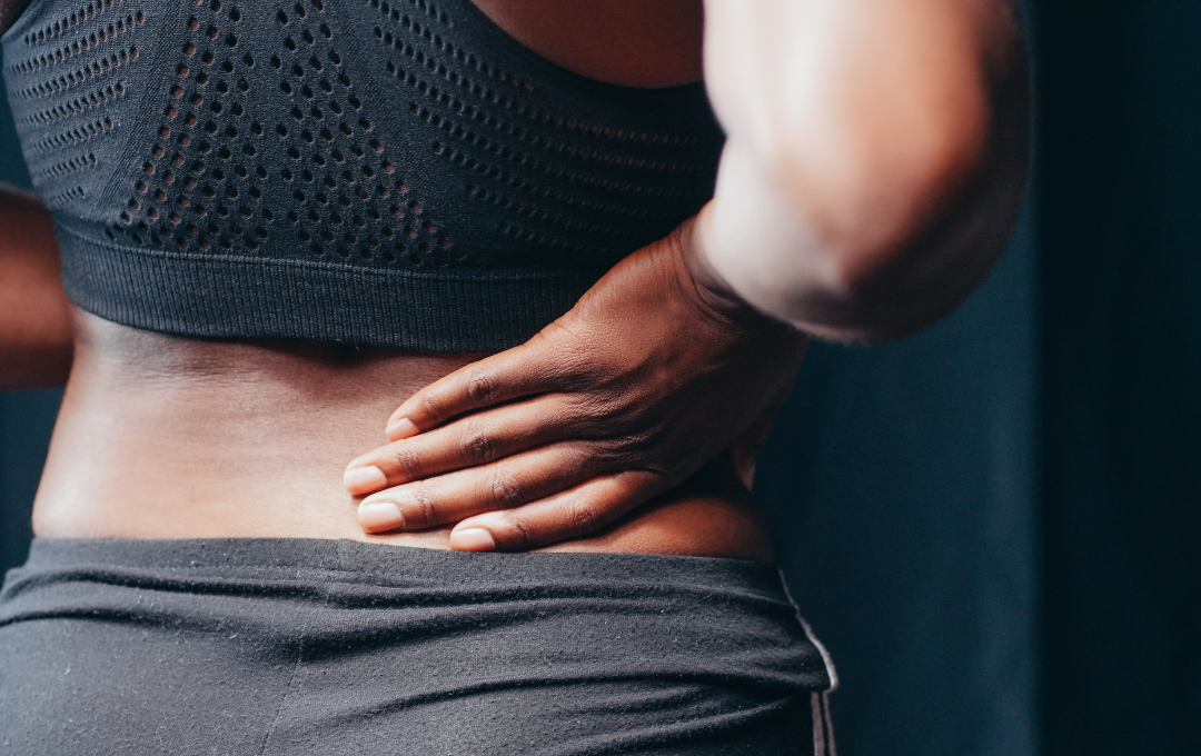 Food To Shrink Fibroids: Do They Work? 4 Woman experiencing lower back pain from fibroids