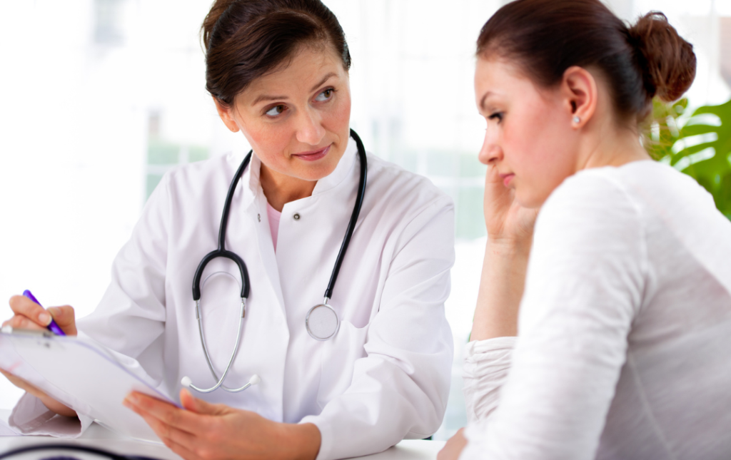 Fibroids And Miscarriage: Should You Consider Ufe Before Trying Again? 3 Woman consulting with fibroid specialist about UFE treatment options